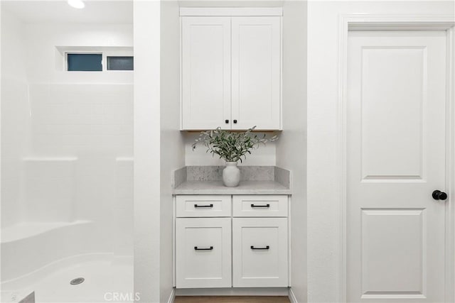 interior space featuring walk in shower