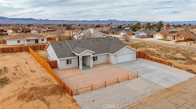 birds eye view of property featuring a residential view and a mountain view