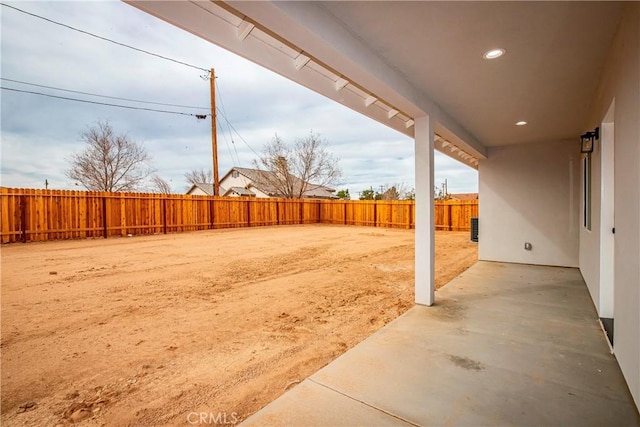 view of yard with a patio area and a fenced backyard