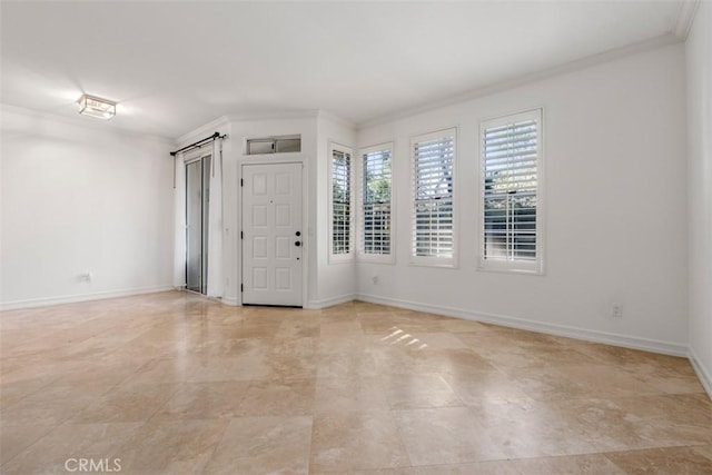 unfurnished room with crown molding and baseboards