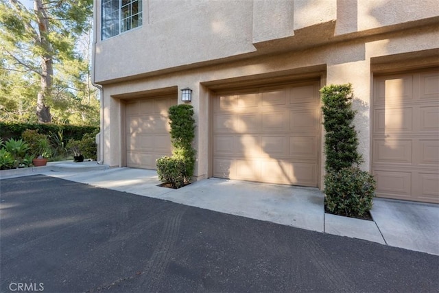 garage featuring driveway