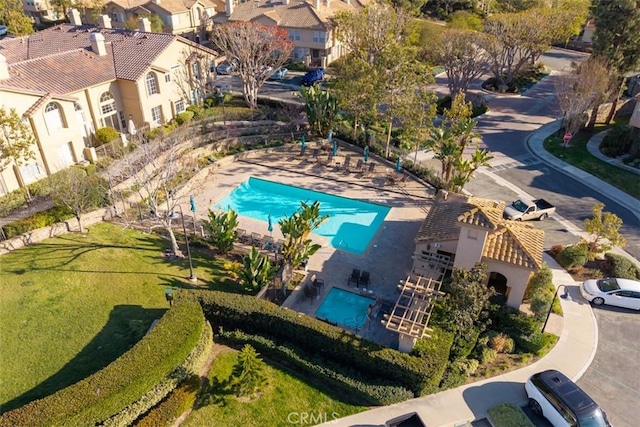 birds eye view of property with a residential view