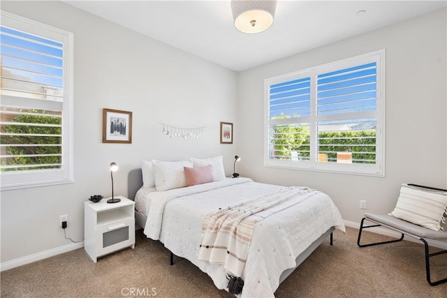 bedroom featuring baseboards and carpet flooring