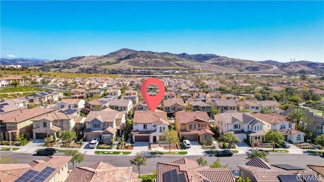 bird's eye view with a residential view and a mountain view