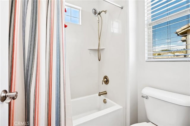 bathroom featuring toilet and shower / bathtub combination with curtain