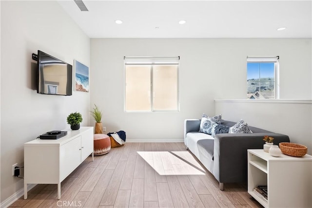 bedroom featuring baseboards, light wood-style flooring, visible vents, and recessed lighting