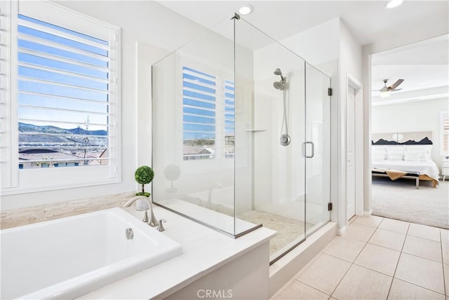 full bath featuring ensuite bathroom, a garden tub, a ceiling fan, a shower stall, and tile patterned floors