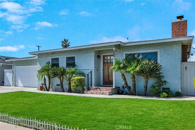 view of front facade featuring a front yard, fence, an attached garage, and stucco siding