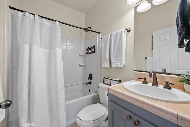 bathroom featuring toilet, shower / bathtub combination with curtain, and vanity