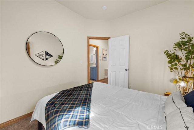 carpeted bedroom featuring visible vents and baseboards