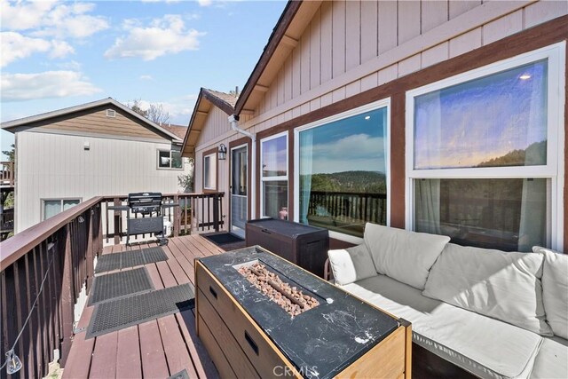 820 Arbula Dr, Crestline, CA 92325 - deck with an outdoor living space with a fire pit