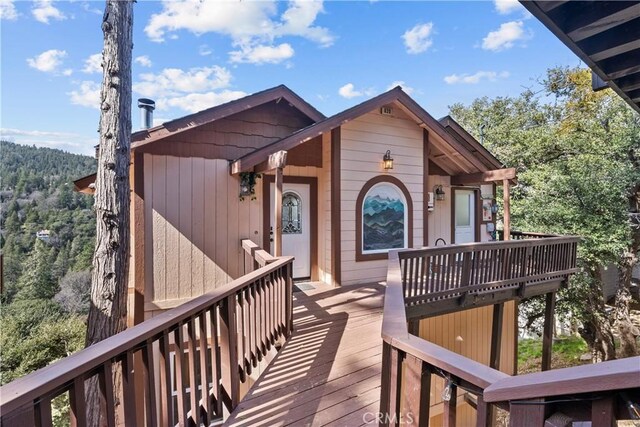820 Arbula Dr, Crestline, CA 92325 - wooden terrace with a wooded view