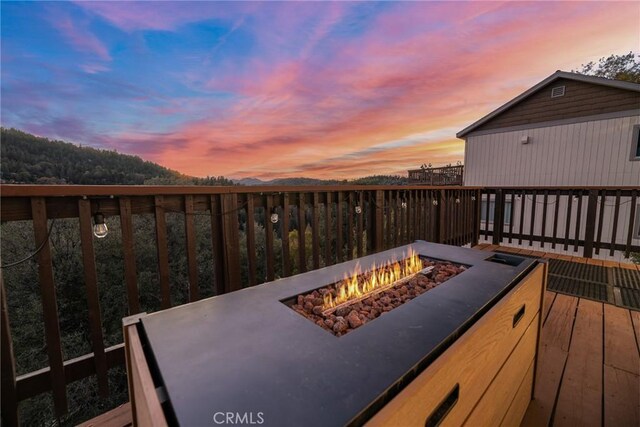 820 Arbula Dr, Crestline, CA 92325 - deck with an outdoor fire pit