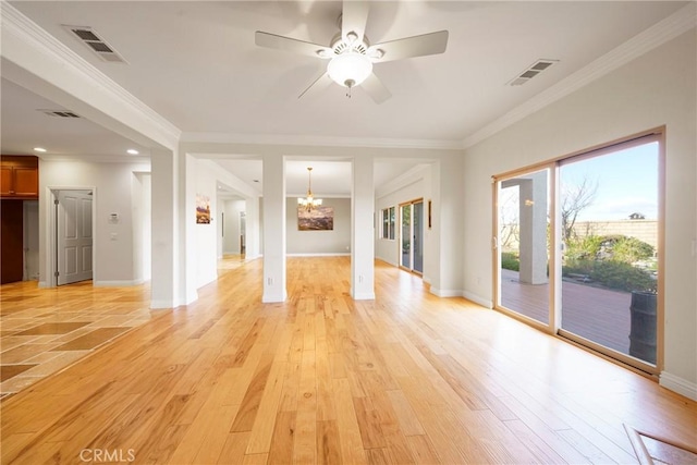 unfurnished room with ornamental molding, visible vents, and light wood-style floors