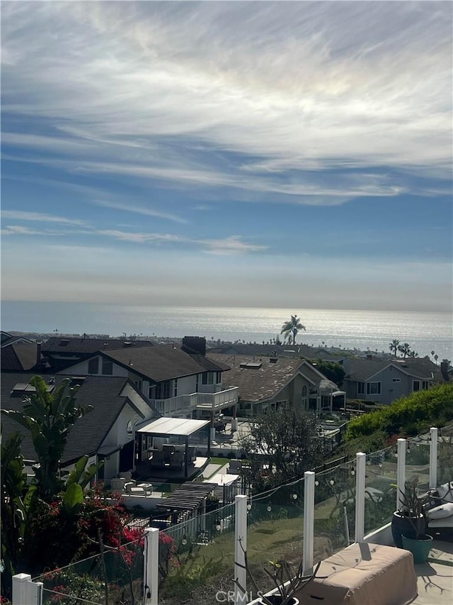 exterior space featuring a water view and a residential view