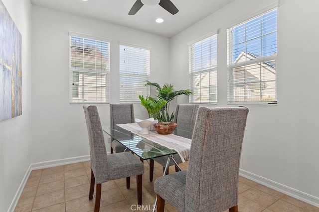 dining space with light tile patterned floors, baseboards, a ceiling fan, and recessed lighting