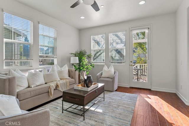 interior space featuring baseboards, recessed lighting, wood finished floors, and a healthy amount of sunlight