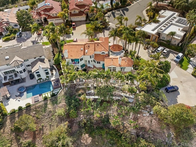 birds eye view of property with a residential view