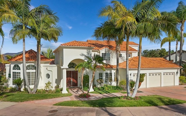1367 Corona, Bonita, CA 91902 - mediterranean / spanish-style home featuring a tiled roof, concrete driveway, stucco siding, and an attached garage