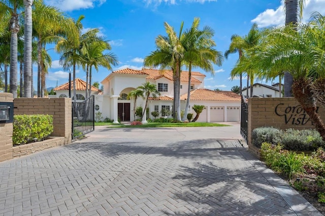 1367 Corona, Bonita, CA 91902 - view of front of property featuring a gate, an attached garage, driveway, a tile roof, and stucco siding