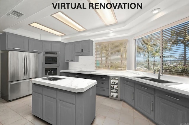 1367 Corona, Bonita, CA 91902 - kitchen with gray cabinets, stainless steel appliances, light marble finish floors, a kitchen island with sink, and decorative backsplash