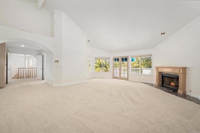 1367 Corona, Bonita, CA 91902 - unfurnished living room with light colored carpet, high vaulted ceiling, arched walkways, a fireplace, and recessed lighting