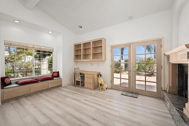 1367 Corona, Bonita, CA 91902 - unfurnished living room with french doors, lofted ceiling, light wood-type flooring, a fireplace with raised hearth, and a desk