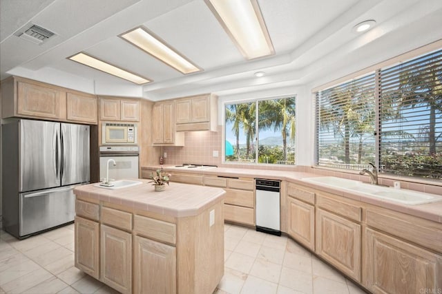 1367 Corona, Bonita, CA 91902 - kitchen with white appliances, light brown cabinets, light marble finish floors, tile counters, and decorative backsplash