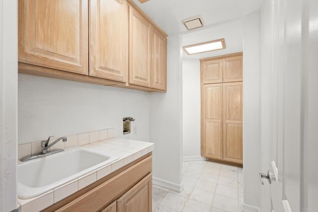 1367 Corona, Bonita, CA 91902 - washroom with cabinet space, light marble finish floors, and washer hookup