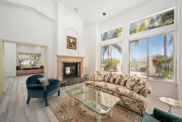 1367 Corona, Bonita, CA 91902 - living area with a high end fireplace, wood finished floors, a towering ceiling, and recessed lighting