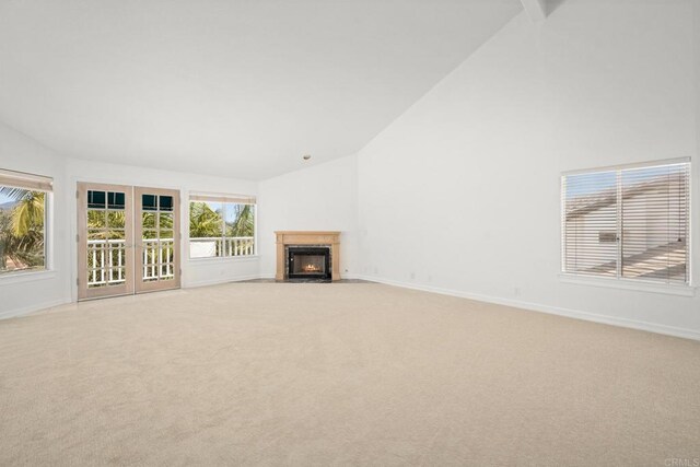 1367 Corona, Bonita, CA 91902 - unfurnished living room with light carpet, high vaulted ceiling, and a fireplace with flush hearth