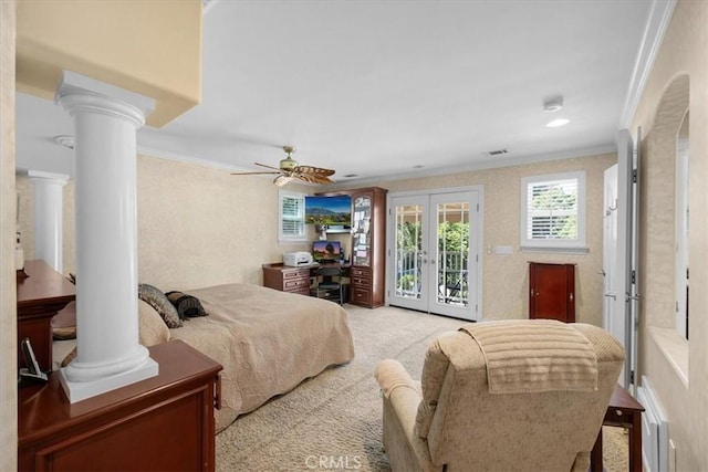 bedroom with ornate columns, crown molding, light colored carpet, and access to exterior