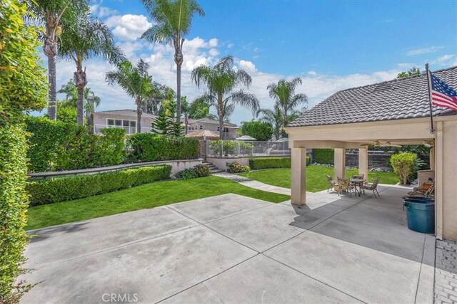 view of patio / terrace featuring a fenced backyard and a gazebo