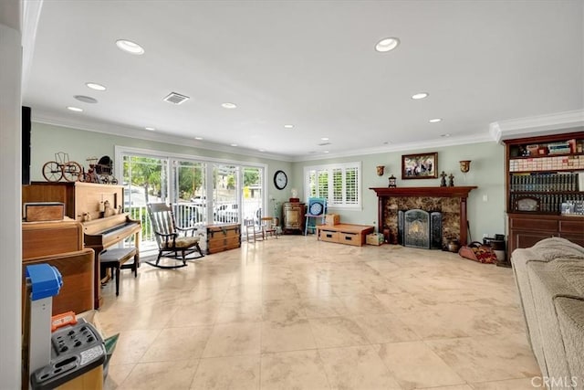 living room with ornamental molding, a fireplace, recessed lighting, and visible vents