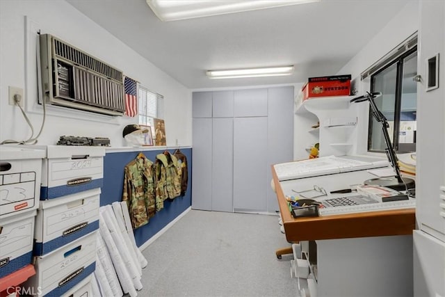 interior space featuring carpet floors, open shelves, and a wall unit AC
