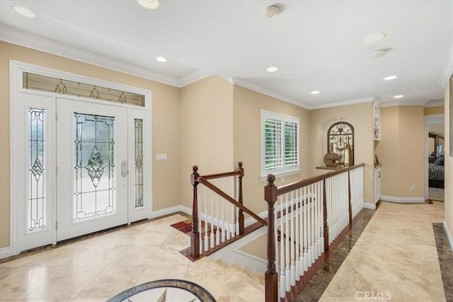 entrance foyer featuring recessed lighting, baseboards, and crown molding