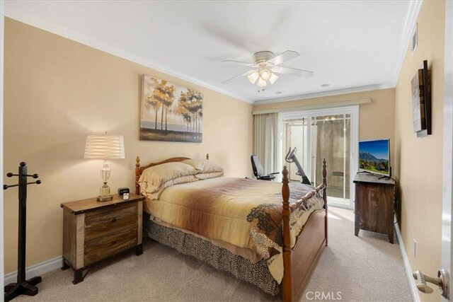 bedroom with crown molding, visible vents, baseboards, light colored carpet, and a ceiling fan