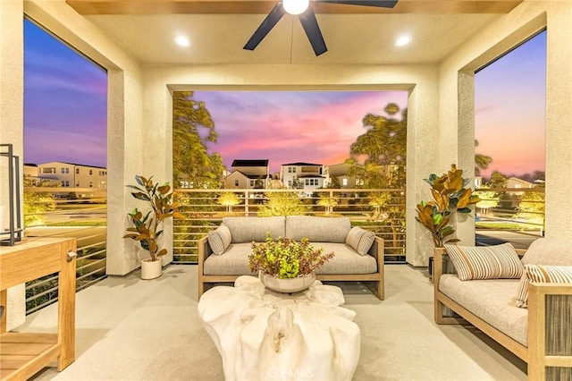 sunroom featuring ceiling fan