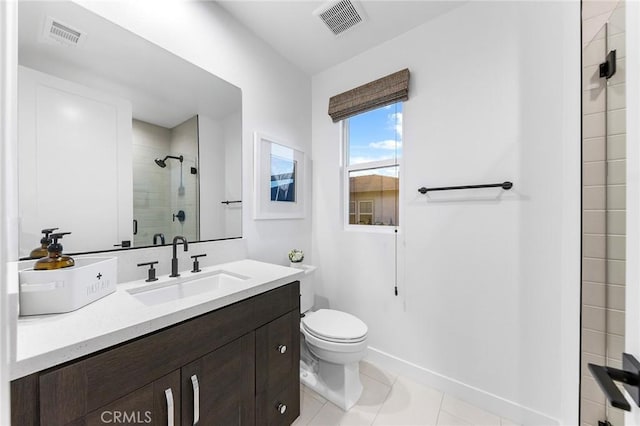 bathroom featuring toilet, a stall shower, visible vents, and tile patterned floors