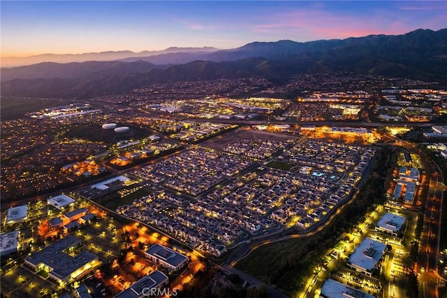 birds eye view of property featuring a mountain view