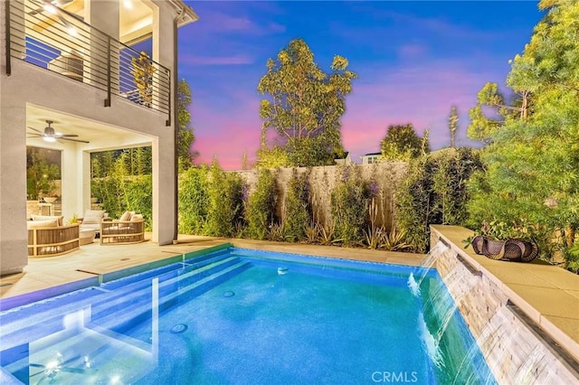 view of pool featuring a patio area and fence