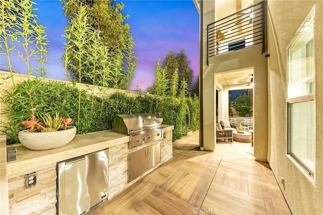 view of patio / terrace featuring a balcony, grilling area, and area for grilling