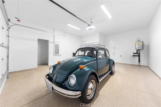 garage featuring electric panel and a garage door opener