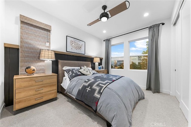 bedroom with a ceiling fan, recessed lighting, light colored carpet, and baseboards