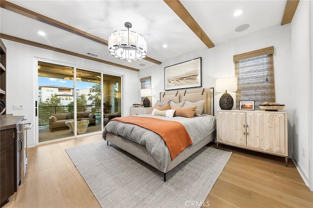 bedroom featuring light wood finished floors, visible vents, access to exterior, a chandelier, and beam ceiling