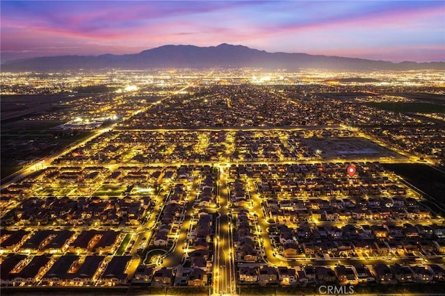 aerial view at dusk with a mountain view