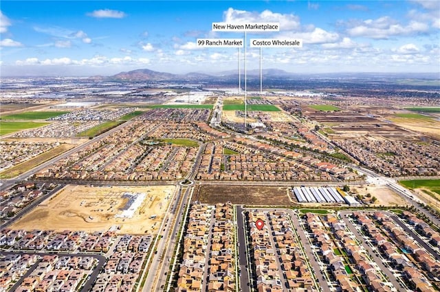 birds eye view of property with a mountain view