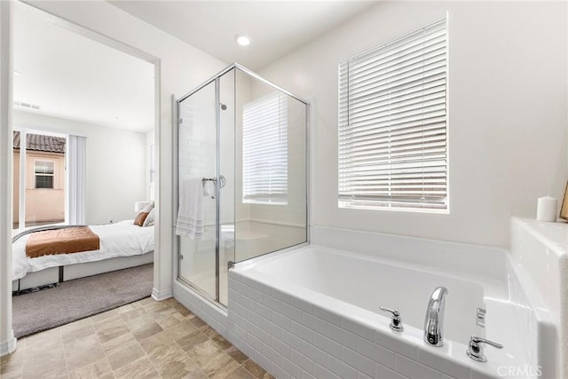 ensuite bathroom with a stall shower, visible vents, a bath, and ensuite bathroom