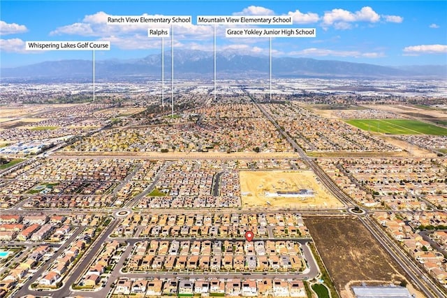 birds eye view of property featuring a mountain view