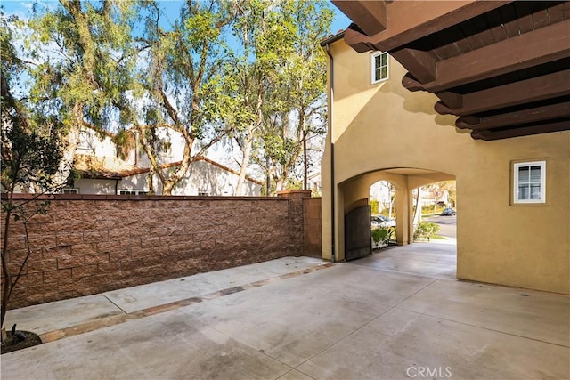 view of patio / terrace with fence and a gate